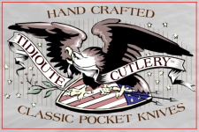 Tidioute Cutlery label: an eagle over a shield with the banner Hand Crafted Classic Pocket Knives
